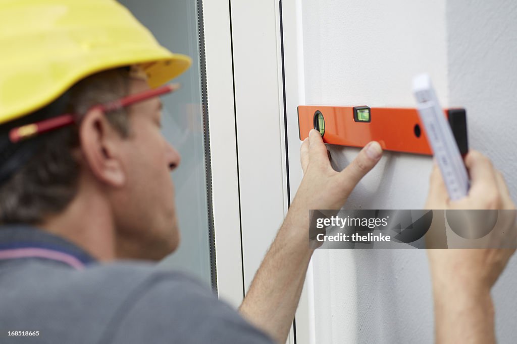 Level In Carpentry Carpenter With A Level High-Res Stock Photo - Getty Images