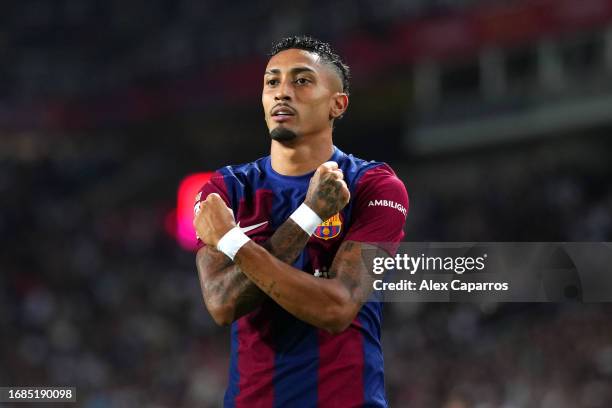 Raphinha of FC Barcelona celebrates after scoring the team's fourth goal during the LaLiga EA Sports match between FC Barcelona and Real Betis at...