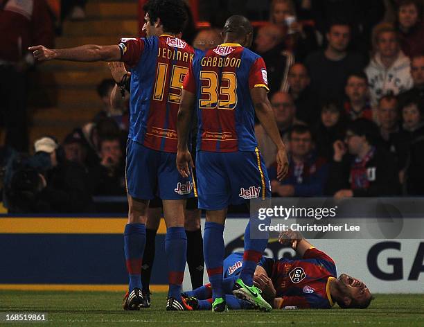 Glenn Murray of Palace looks in pain after going down with an injury and later stretchered off the field during the npower Championship Play Off Semi...