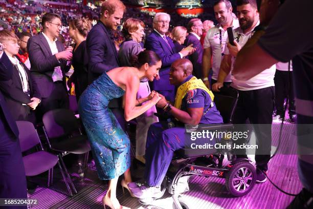 Prince Harry, Duke of Sussex, and Meghan, Duchess of Sussex greet fans as they attend the closing ceremony of the Invictus Games Düsseldorf 2023 at...