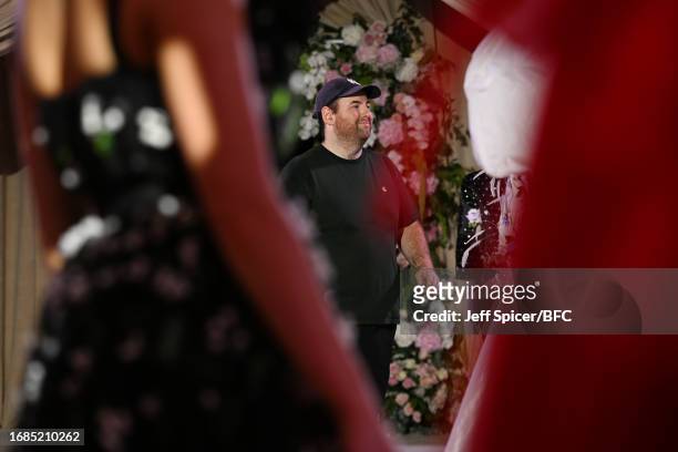 Richard Quinn walks the runway at the Richard Quinn show during London Fashion Week September 2023 at the Andaz Hotel on September 16, 2023 in...
