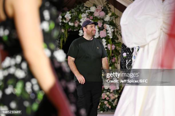 Richard Quinn walks the runway at the Richard Quinn show during London Fashion Week September 2023 at the Andaz Hotel on September 16, 2023 in...