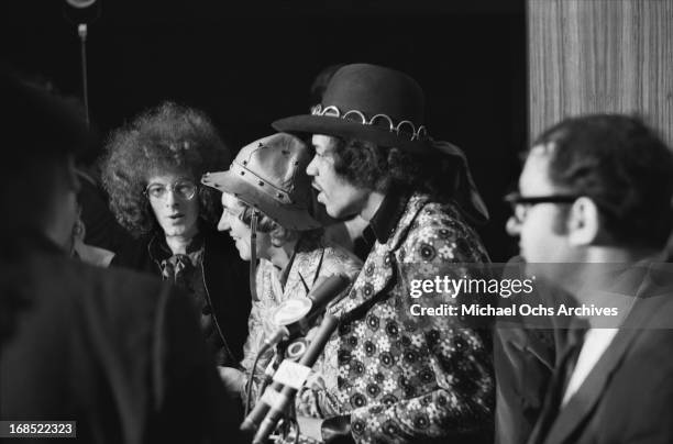 Noel Redding, Mitch Mitchell and Jimi Hendrix of The Jimi Hendrix Experience pose for photos at a multi band press conference titled 'The British Are...