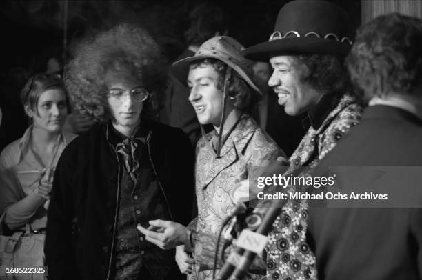 Noel Redding, Mitch Mitchell and Jimi Hendrix of The Jimi Hendrix Experience pose for photos at a multi band press conference titled 'The British Are...