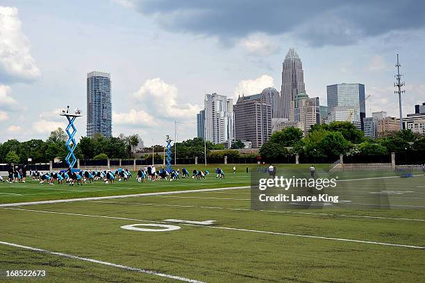 General view as players of the Carolina Panthers stretch during the Panthers Rookie Camp at the team's practice facility on May 10, 2013 in...