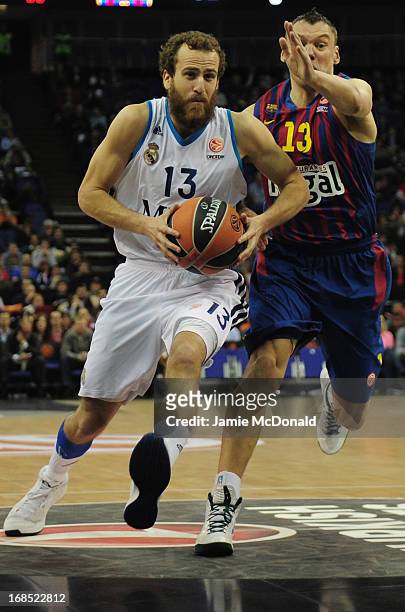 Sergio Rodriguez of Real Madrid tussles with Sarunas Jasikevicius of FC Barcelona during the Turkish Airlines EuroLeague Final Four semi final game...