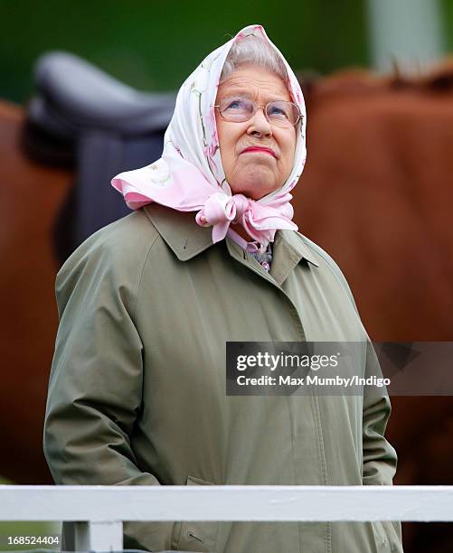 Queen Elizabeth II watches her horse Barbers Shop win the Tattersalls & Ror Thoroughbred Ridden Show Horse Class on day 3 of the Royal Windsor Horse...