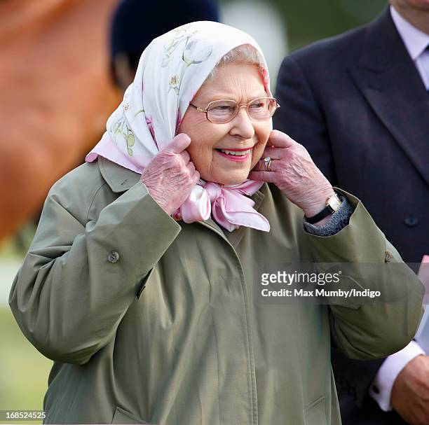 Queen Elizabeth II watches her horse Barbers Shop win the Tattersalls & Ror Thoroughbred Ridden Show Horse Class on day 3 of the Royal Windsor Horse...