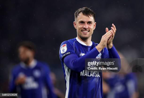 Aaron Ramsey of Cardiff City applauds the fans as he celebrates victory after defeating Swansea City during the Sky Bet Championship match between...