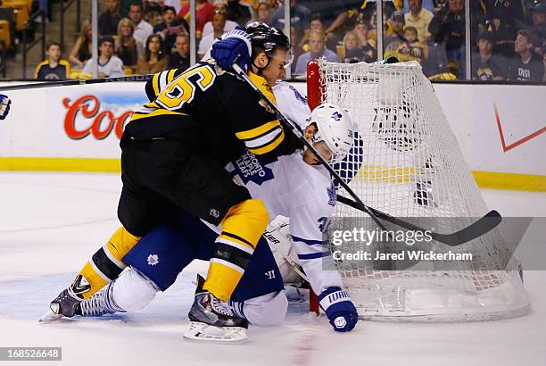 David Krejci of the Boston Bruins and Carl Gunnarsson of the Toronto Maple Leafs get tangled up in front of the net in Game Five of the Eastern...