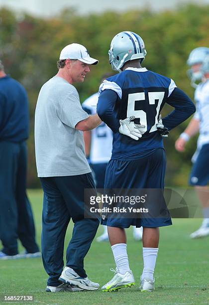 DeVonte Holloman talks with a coaching assistant during the Dallas Cowboys Rookie Minicamp at the Dallas Cowboys Valley Ranch Headquarters on May 10,...