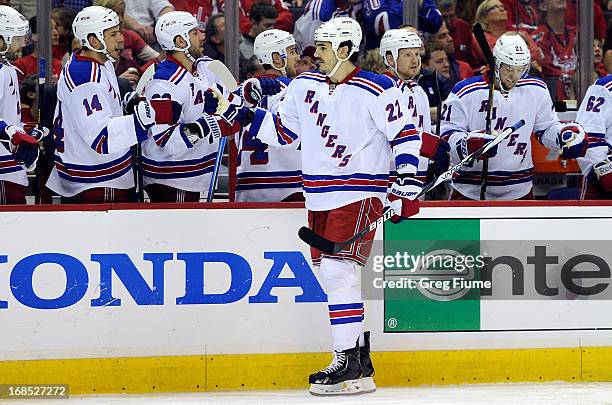 Brian Boyle of the New York Rangers celebrates with teammates after scoring in the first period against the Washington Capitals in Game Five of the...