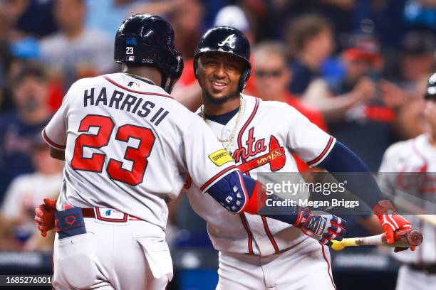 Michael Harris II of the Atlanta Braves celebrates with teammate Ozzie Albies after hitting a home run against the Miami Marlins during the fifth...