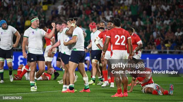 James Lowe of Ireland celebrates scoring the team's seventh try with teammates during the Rugby World Cup France 2023 match between Ireland and Tonga...