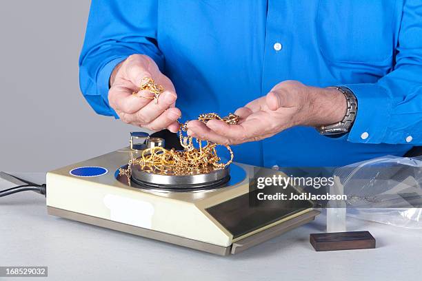 two handy holding and weighing scrap gold - stern gold stock pictures, royalty-free photos & images