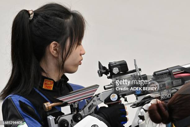 China's Huang Yuting competes in the women's 10m air rifle shooting qualification during the 2022 Asian Games in Hangzhou in China's eastern Zhejiang...