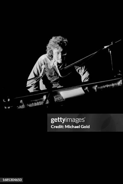 Singer and composer Randy Newman plays onstage after his performance in Lincoln Center's Avery Fisher Hall, circa 1973 in New York City, New York.