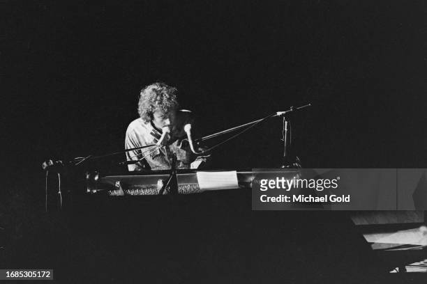 Singer and composer Randy Newman plays onstage after his performance in Lincoln Center's Avery Fisher Hall, circa 1973 in New York City, New York.