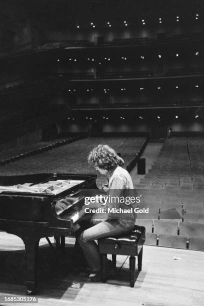 Singer and composer Randy Newman plays onstage after his performance in Lincoln Center's Avery Fisher Hall, circa 1973 in New York City, New York.