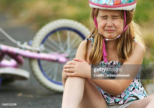 little girl injured from bicycle crash - bicycle crash stock pictures, royalty-free photos & images