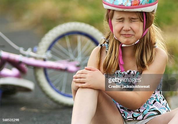 little girl injured from bicycle crash - accident girl stock pictures, royalty-free photos & images