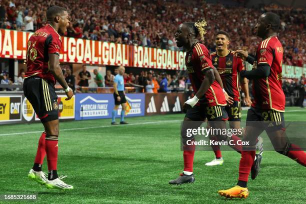 Xande Silva of Atlanta United celebrates with teammates after an own goal by Kamal Miller of Inter Miami CF during the first half at Mercedes-Benz...