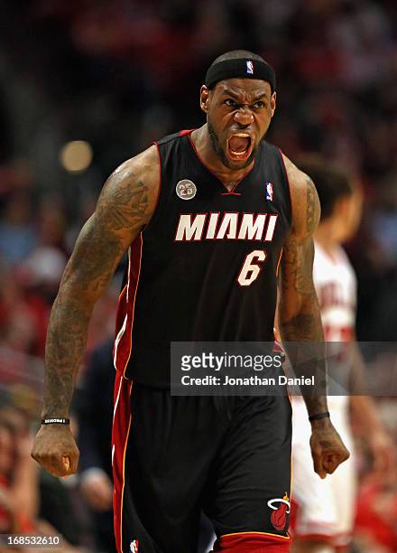 LeBron James of the Miami Heat reacts after hitting a three point shot in the 4th quarter against the Chicago Bulls in Game Three of the Eastern...