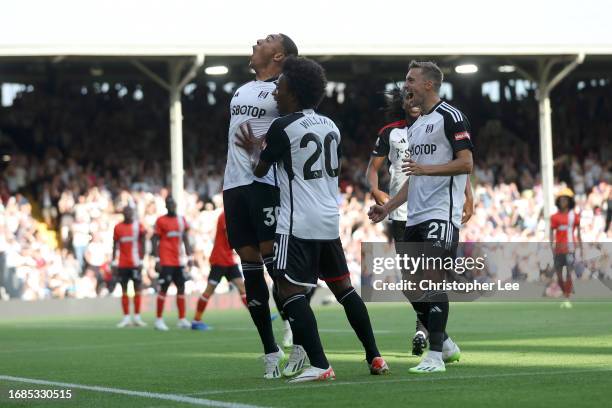 Carlos Vinicius of Fulham celebrates scoring their first goal during the Premier League match between Fulham FC and Luton Town at Craven Cottage on...