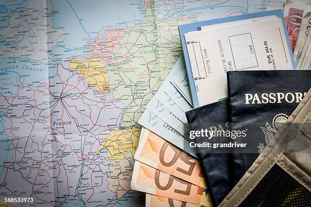 european currency, american passport, airline tickets and map - passport stock pictures, royalty-free photos & images