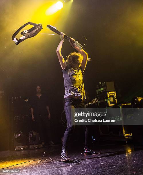Vocalist / guitarist Emily Armstrong of Dead Sara smashes a guitar while performing at El Rey Theatre on May 9, 2013 in Los Angeles, California.