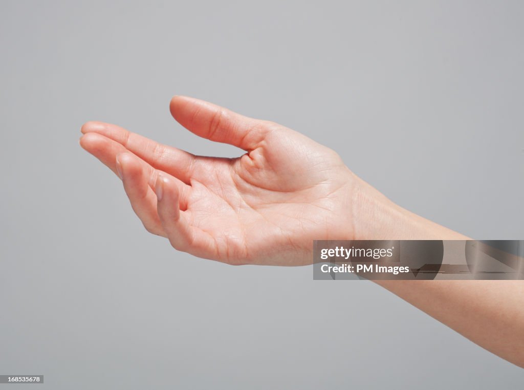 Woman's hand reaching out