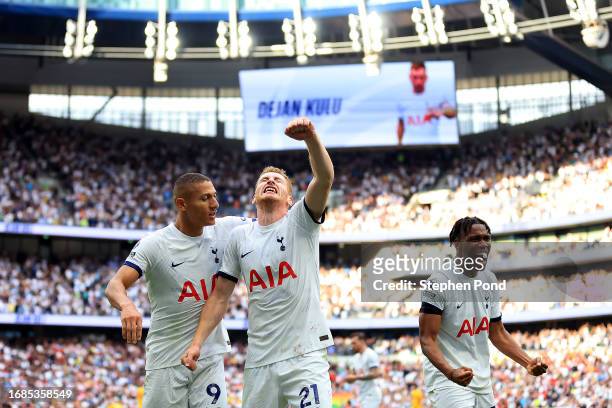 Dejan Kulusevski of Tottenham Hotspur celebrates with teammates Richarlison and Destiny Udogie after scoring the team's second goal during the...