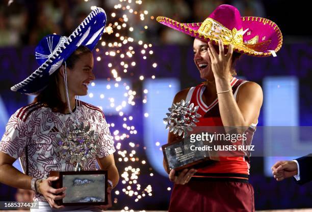 Greece's Maria Sakkari and USA's Caroline Dolehide, wearing Mexican hats, pose on the podium with their trophies during the awards ceremony at the...