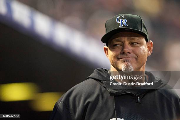 Dante Bichette of the Colorado Rockies looks out from the dugout during a game against the New York Yankees at Coors Field on May 8, 2013 in Denver,...