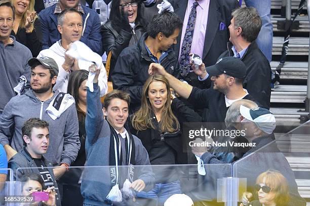 Alyssa Milano and husband David Bugliari attend an NHL playoff game between the St. Louis Blues and the Los Angeles Kings at Staples Center on May...