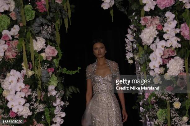 Model walks the runway at the Richard Quinn show during London Fashion Week September 2023 at the Andaz Hotel on September 16, 2023 in London,...