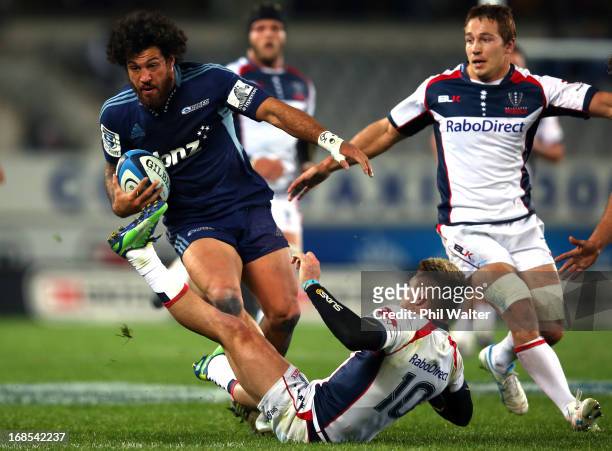 Rene Ranger of the Blues runs rampant over James O'Connor of the Rebels during the round 13 Super Rugby match between the Blues and the Western Force...