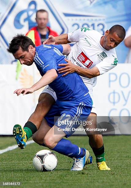 Marko Lomic of FC Dynamo Moscow is challenged by Isael of FC Krasnodar during the Russian Premier League match between FC Dynamo Moscow and FC...