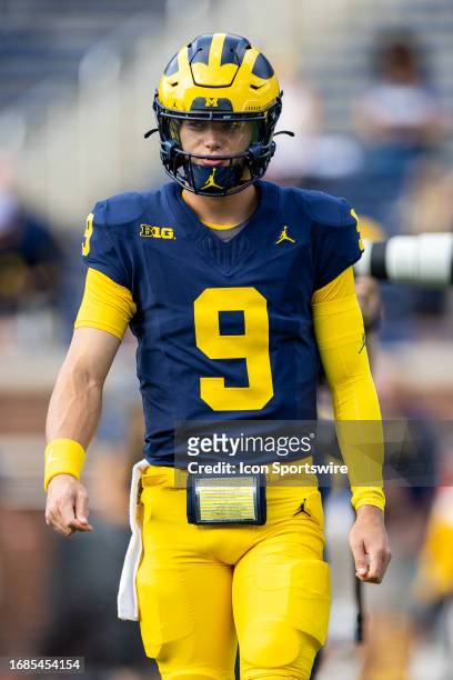 Michigan Wolverines quarterback J.J. McCarthy warms up before the college men's football game between the Rutgers Scarlet Knights and the Michigan...