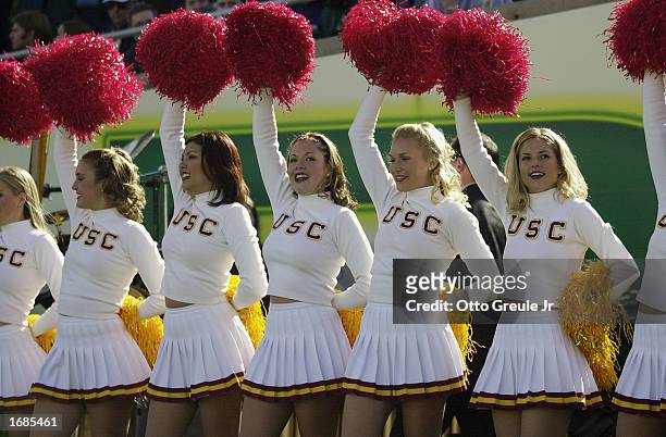 Trojans cheerleaders show support for the Trojans during the game against the Oregon Ducks at Autzen Stadium on October 26, 2002 in Eugene, Oregon....