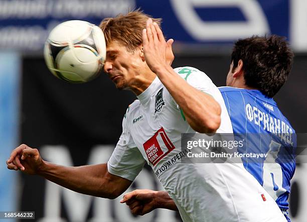 Leandro Fernandez of FC Dynamo Moscow is challenged by Alyaksandr Martynovich of FC Krasnodar during the Russian Premier League match between FC...