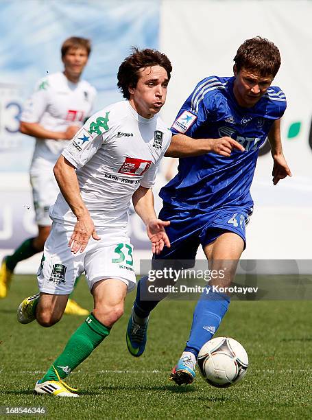 Aleksandr Sapeta of FC Dynamo Moscow is challenged by Mauricio Pereyra of FC Krasnodar during the Russian Premier League match between FC Dynamo...