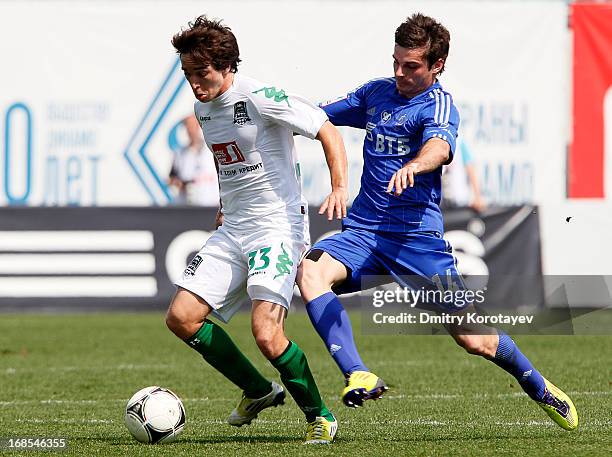 Artur Yusupov of FC Dynamo Moscow is challenged by Mauricio Pereyra of FC Krasnodar during the Russian Premier League match between FC Dynamo Moscow...