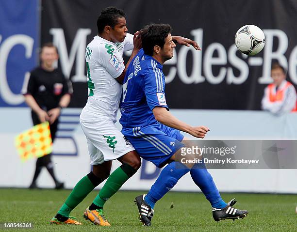 Leandro Fernandez of FC Dynamo Moscow is challenged by Wanderson of FC Krasnodar during the Russian Premier League match between FC Dynamo Moscow and...