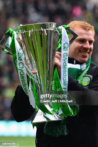 Celtic Manager Neil Lennon poses with the Scottish Premier League trophy following the Clydesdale Bank Scottish Premier League match between Celtic...