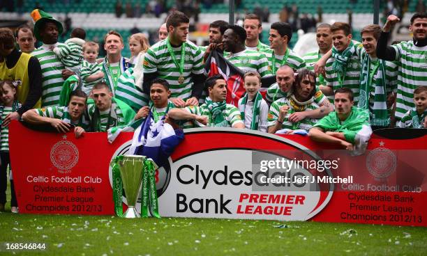 Celtic players celebrate with the Scottish Premier League trophy following the Clydesdale Bank Scottish Premier League match between Celtic and St...