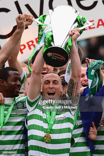 Scott Brown of Celtic lifts the Scottish Premier League trophy following the Clydesdale Bank Scottish Premier League match between Celtic and St...