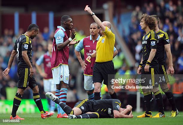 Christian Benteke of Aston Villa reacts as he is shown a red card by referee Lee Mason during the Barclays Premier League match between Aston Villa...