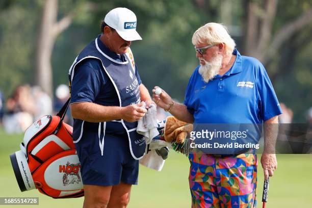 John Daly of the United States takes his ball from his caddie on the 16th hole during the second round of the Sanford International at Minnehaha...