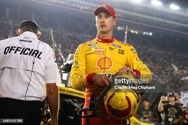 Joey Logano, driver of the Shell Pennzoil Ford, reacts to exiting the race after an on-track incident during the NASCAR Cup Series Bass Pro Shops...